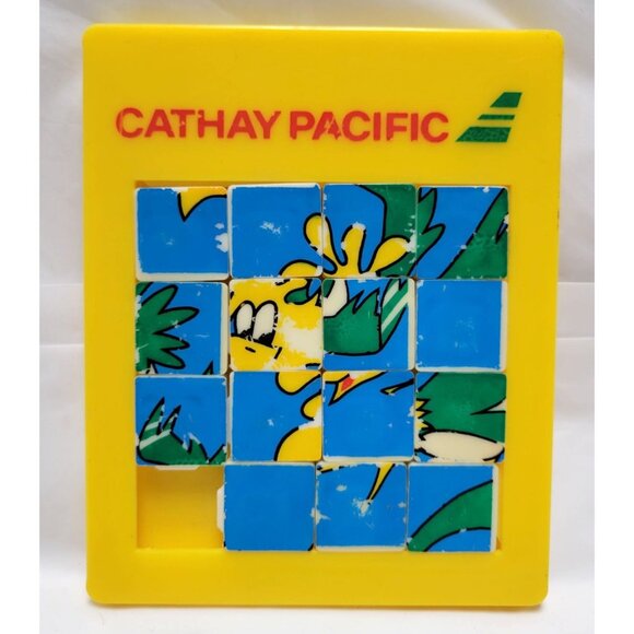 Vintage Cathay Pacific Yellow Sliding Puzzle Cartoon Graphic Collectible Toy - Picture 1 of 2